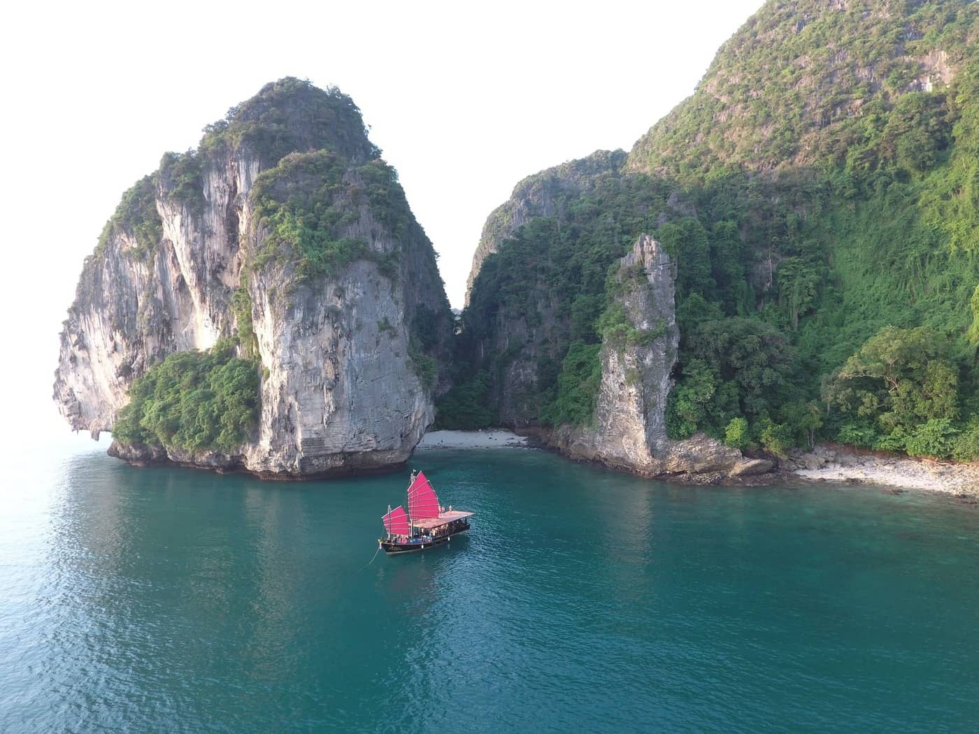 Krabi Sunset Cruises junk boat sailing by secret beach at Poda Island