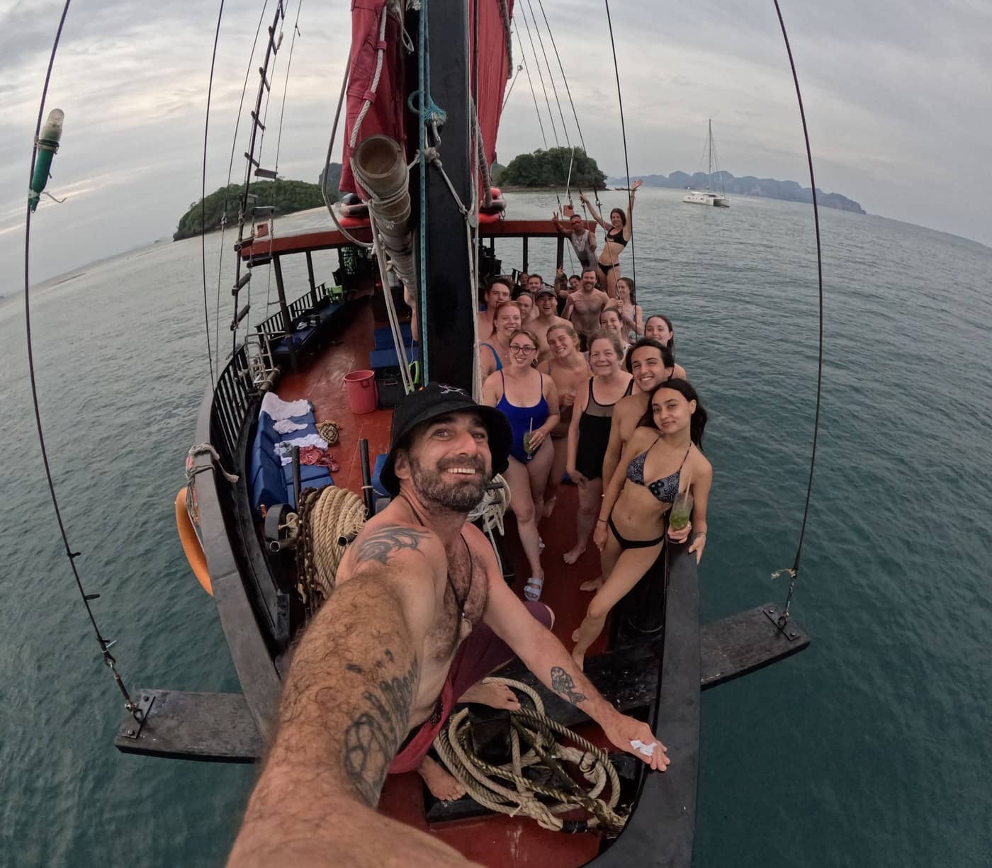 Group of friends enjoying a private cruise aboard the traditional Pla Luang boat in Krab