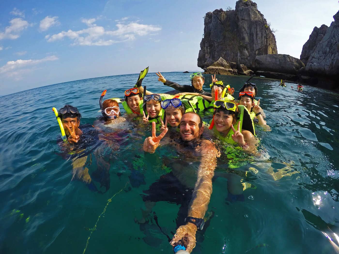 Guests snorkeling with their guide in clear water during a private island cruise in Krabi.