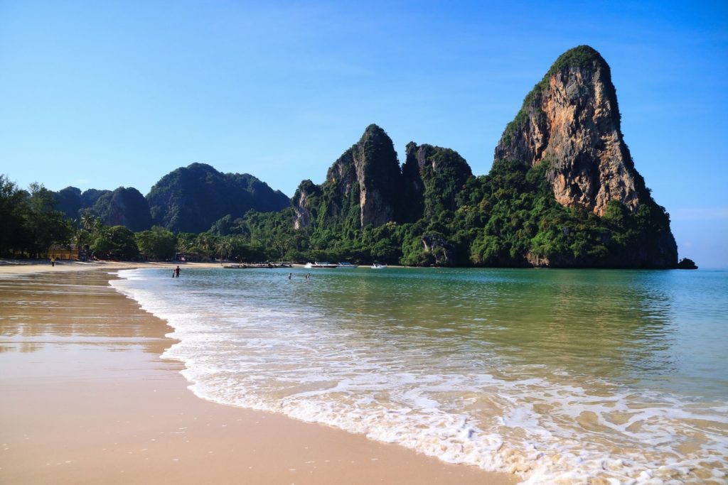 Image of Railay Beach in Krabi, Thailand showing sand, sea and blue skies