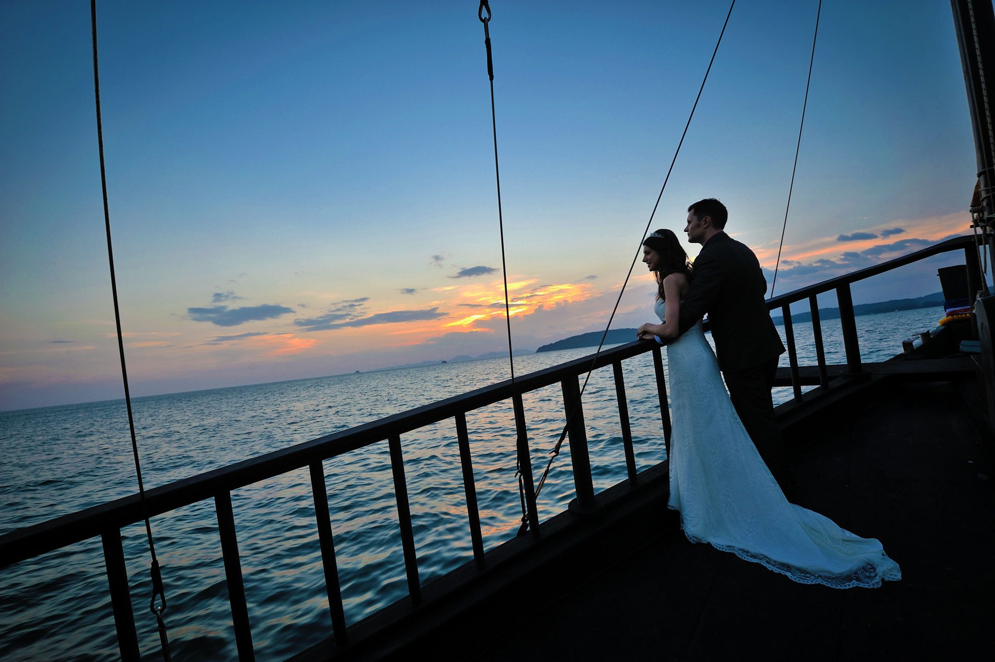 couple lookingout to see after their krabi wedding on krabi sunset cruise thailand