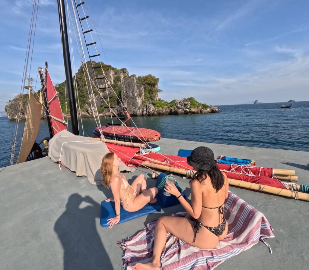 Guests relaxing on the rooftop deck during a Krabi 4 island cruise